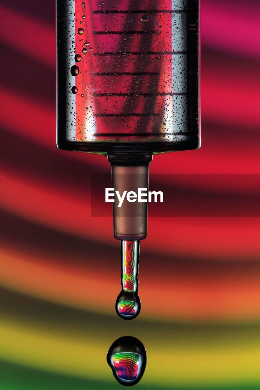 Close-up of water drops from glass container