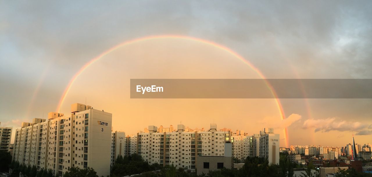 Rainbow over city