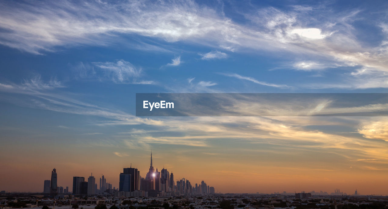 BUILDINGS IN CITY DURING SUNSET