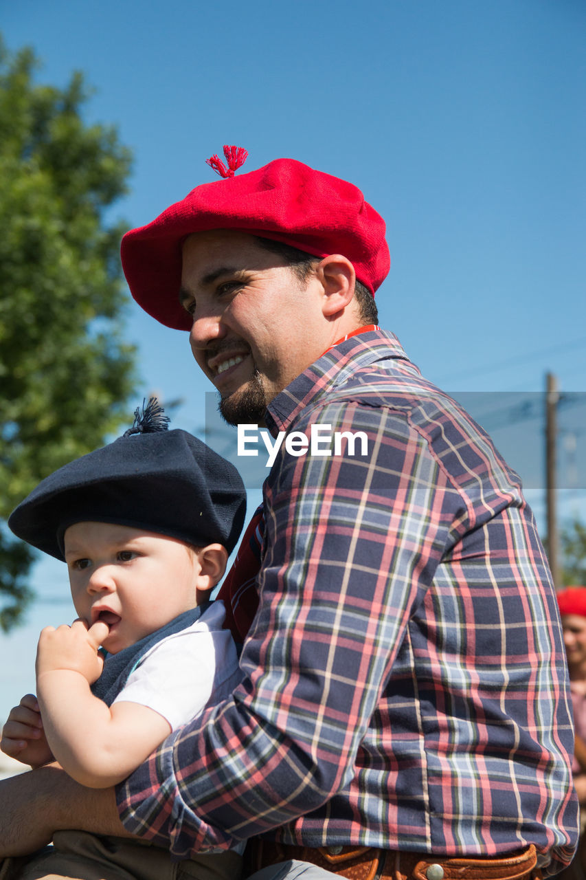 Argentinian father and son in traditional festival