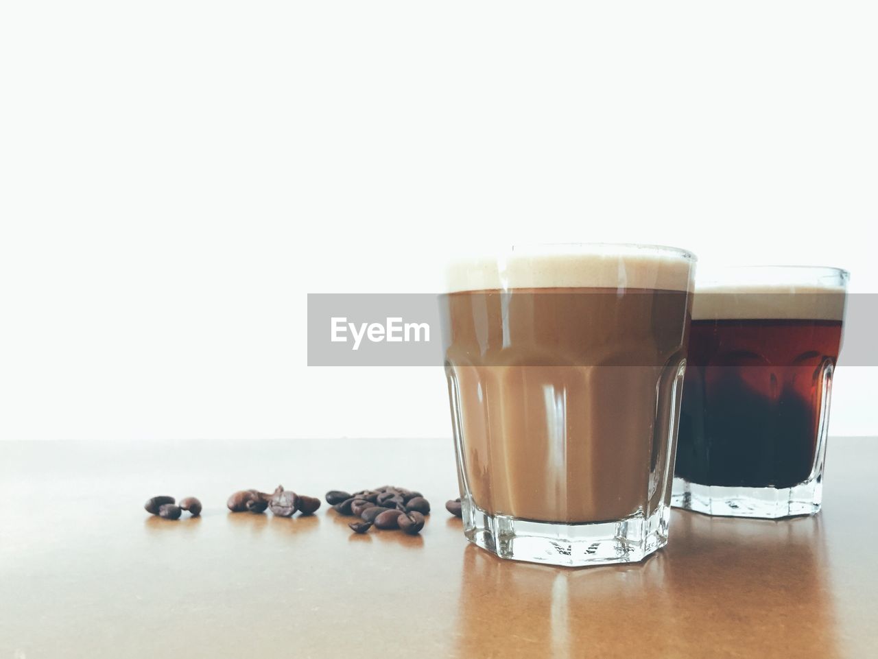 Close-up of coffee on table against white background