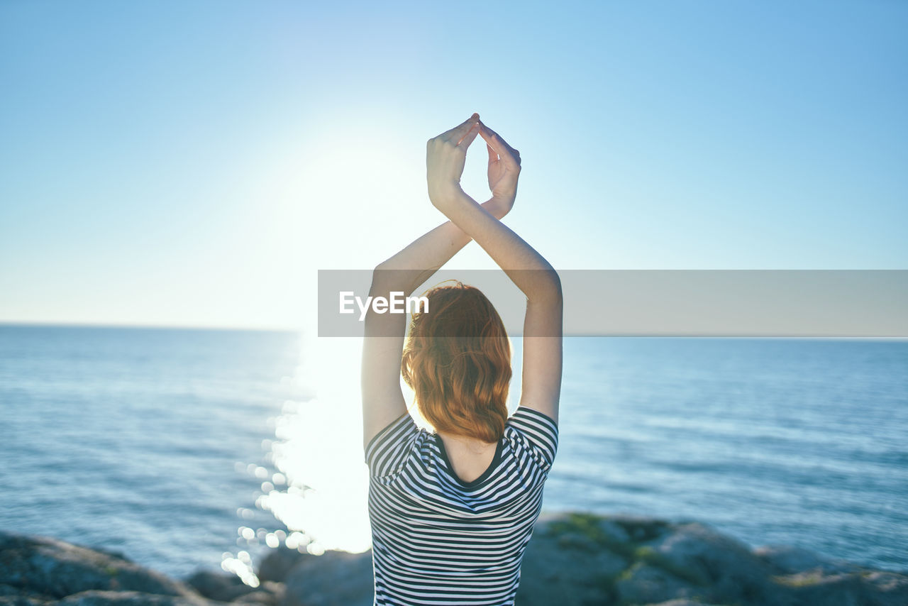 Rear view of woman looking at sea