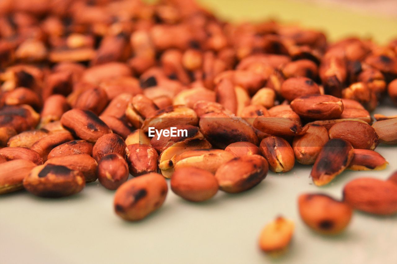 Close-up of roasted peanuts on table