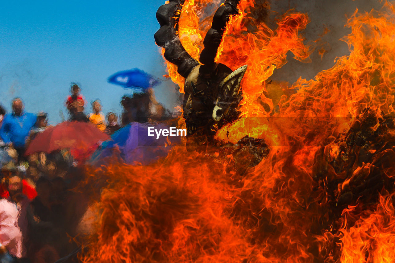 fire, burning, flame, heat, group of people, nature, communication, warning sign, sign, motion, bonfire, person, outdoors, adult, men