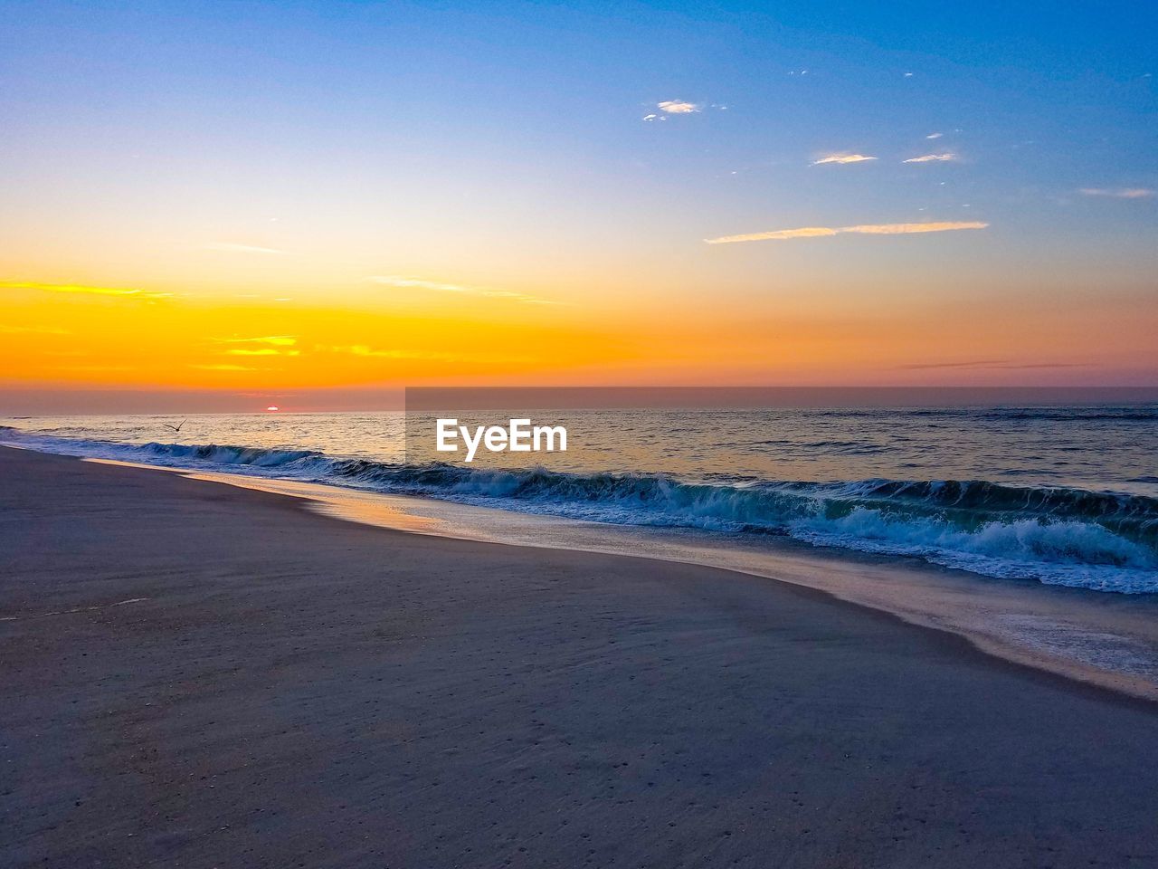 SCENIC VIEW OF SEA DURING SUNSET