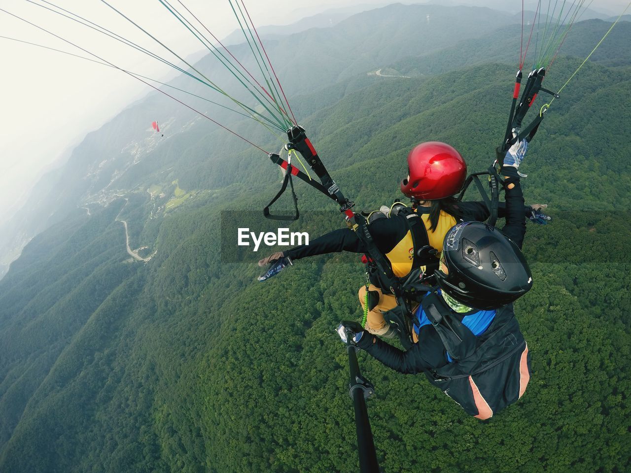 People parachuting above mountains