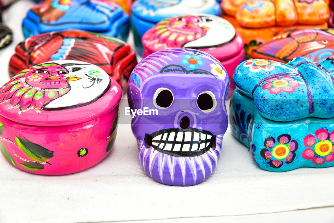 Close-up of multi colored decorations at market for sale