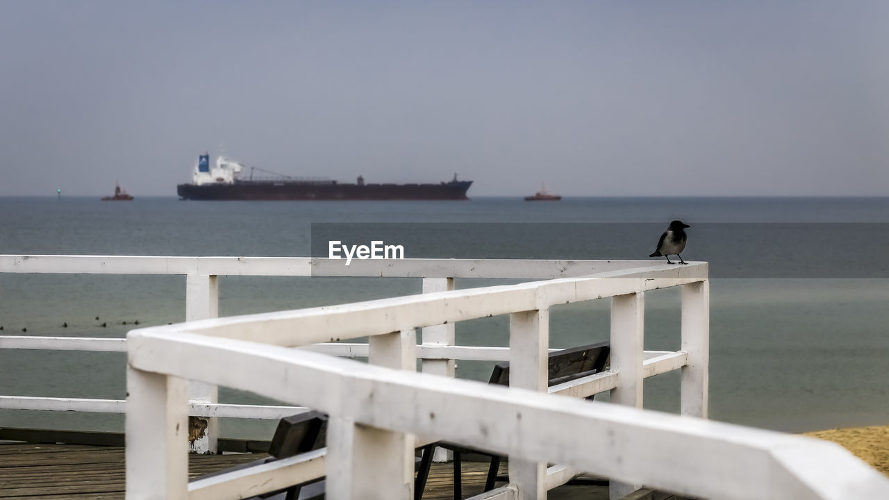 PIER ON SEA AGAINST SKY