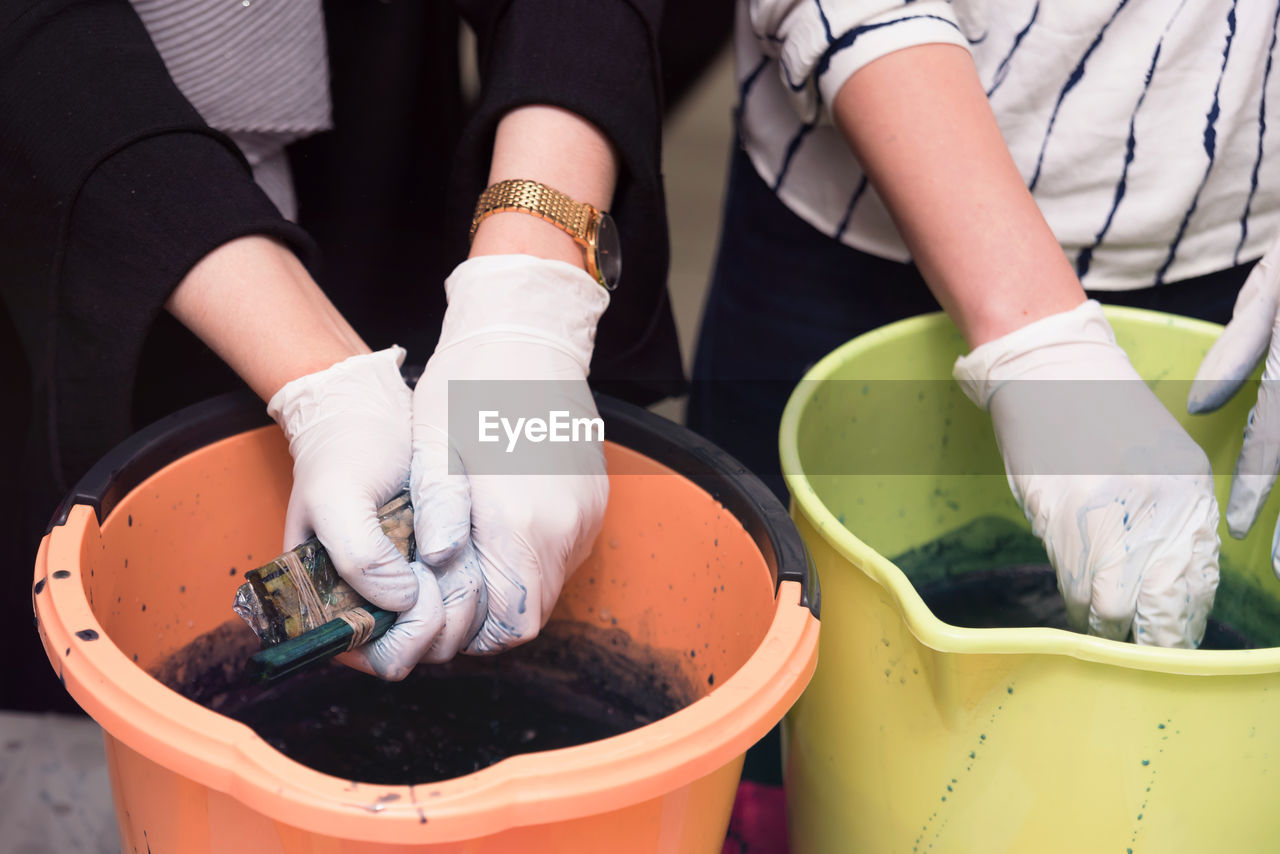 HIGH ANGLE VIEW OF PEOPLE WORKING IN POT