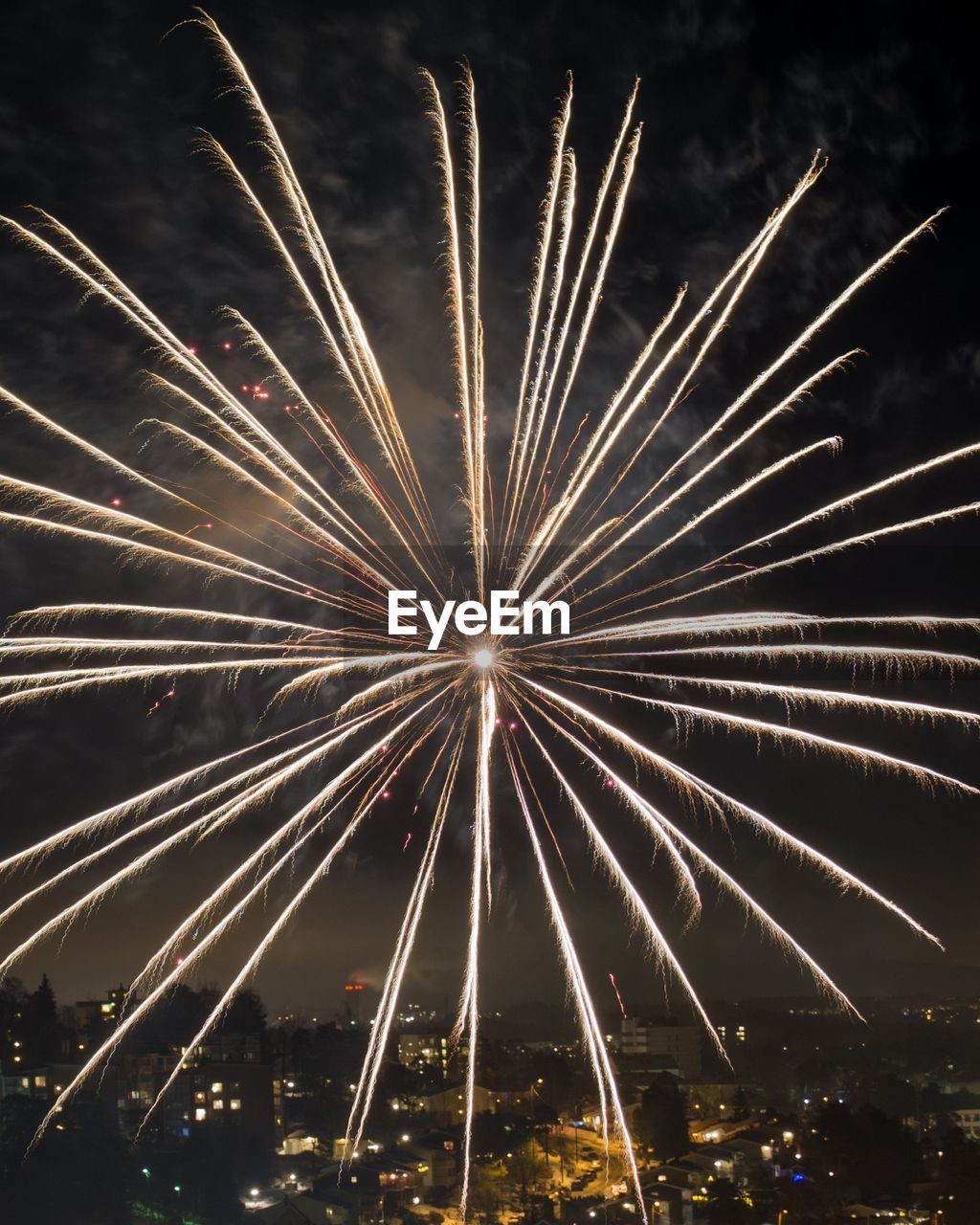 Low angle view of firework display at night