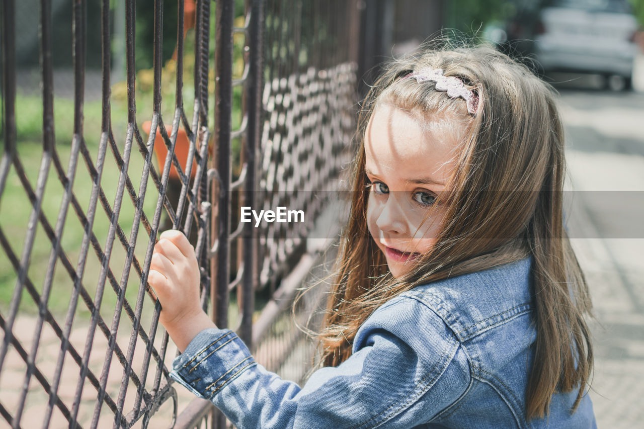 Portrait of girl standing outdoors