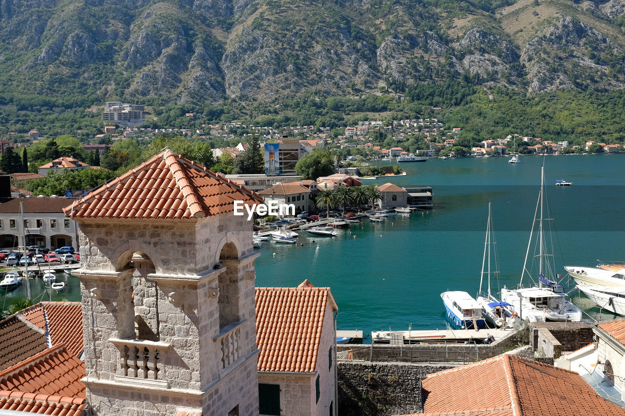 High angle view of buildings by sea