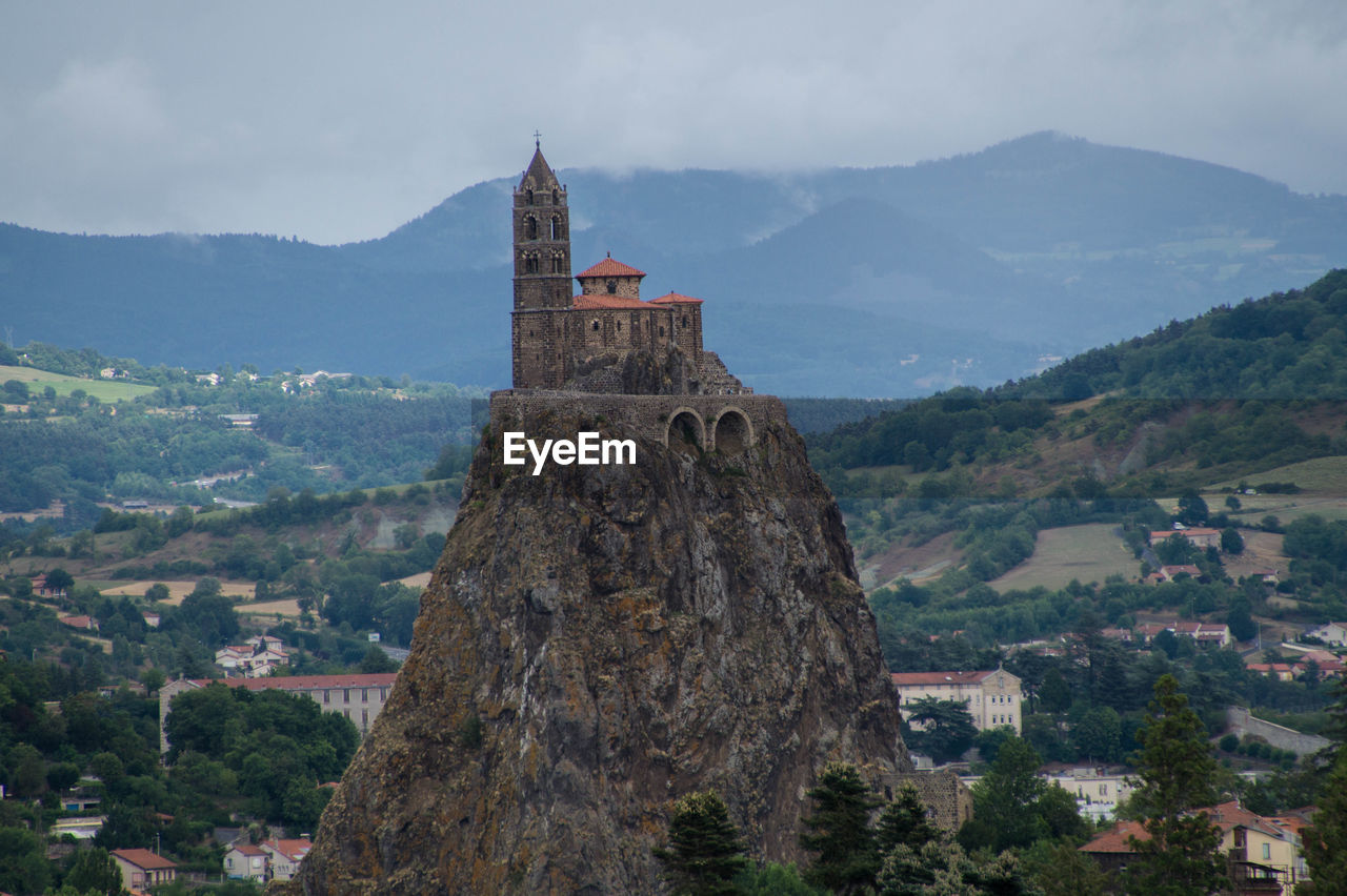 Saint michel daiguilhe chapel at hill top against mountains