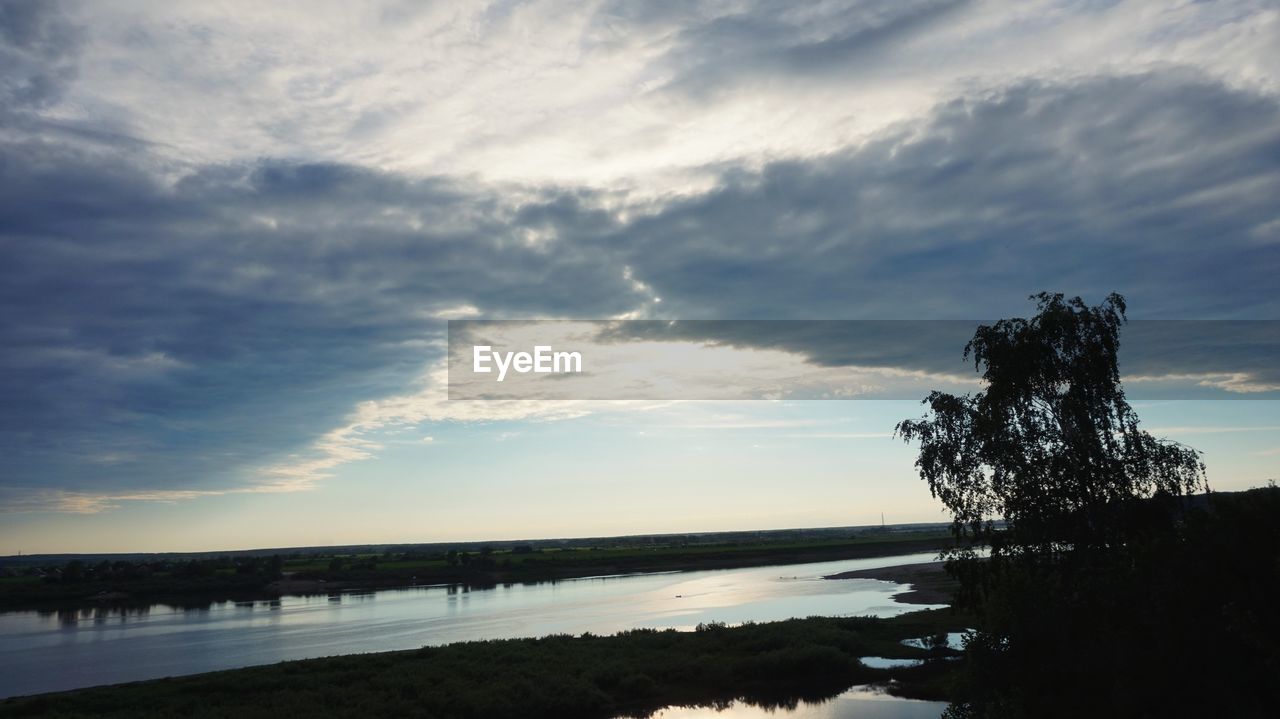 SCENIC VIEW OF SUNSET OVER LAKE