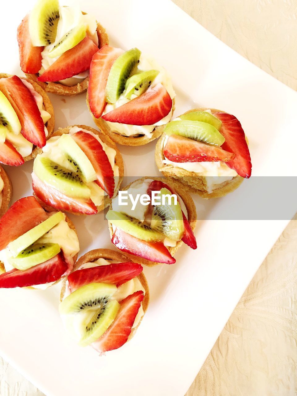 High angle view of fruits sweet dessert in plate on table