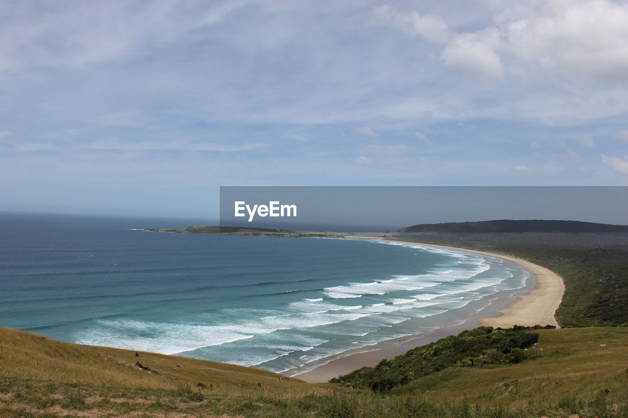 Scenic view of beach against sky