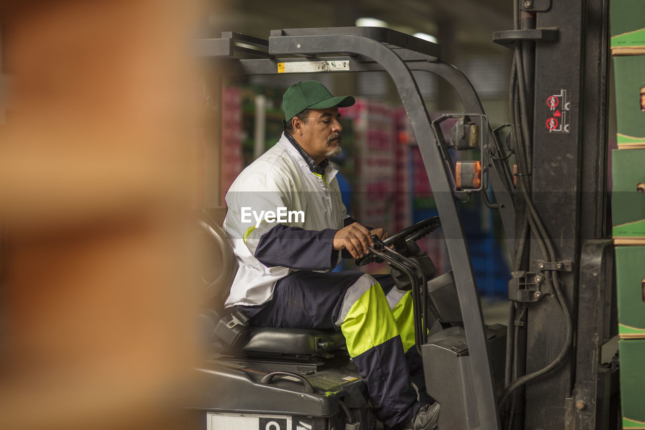 Worker in forklift