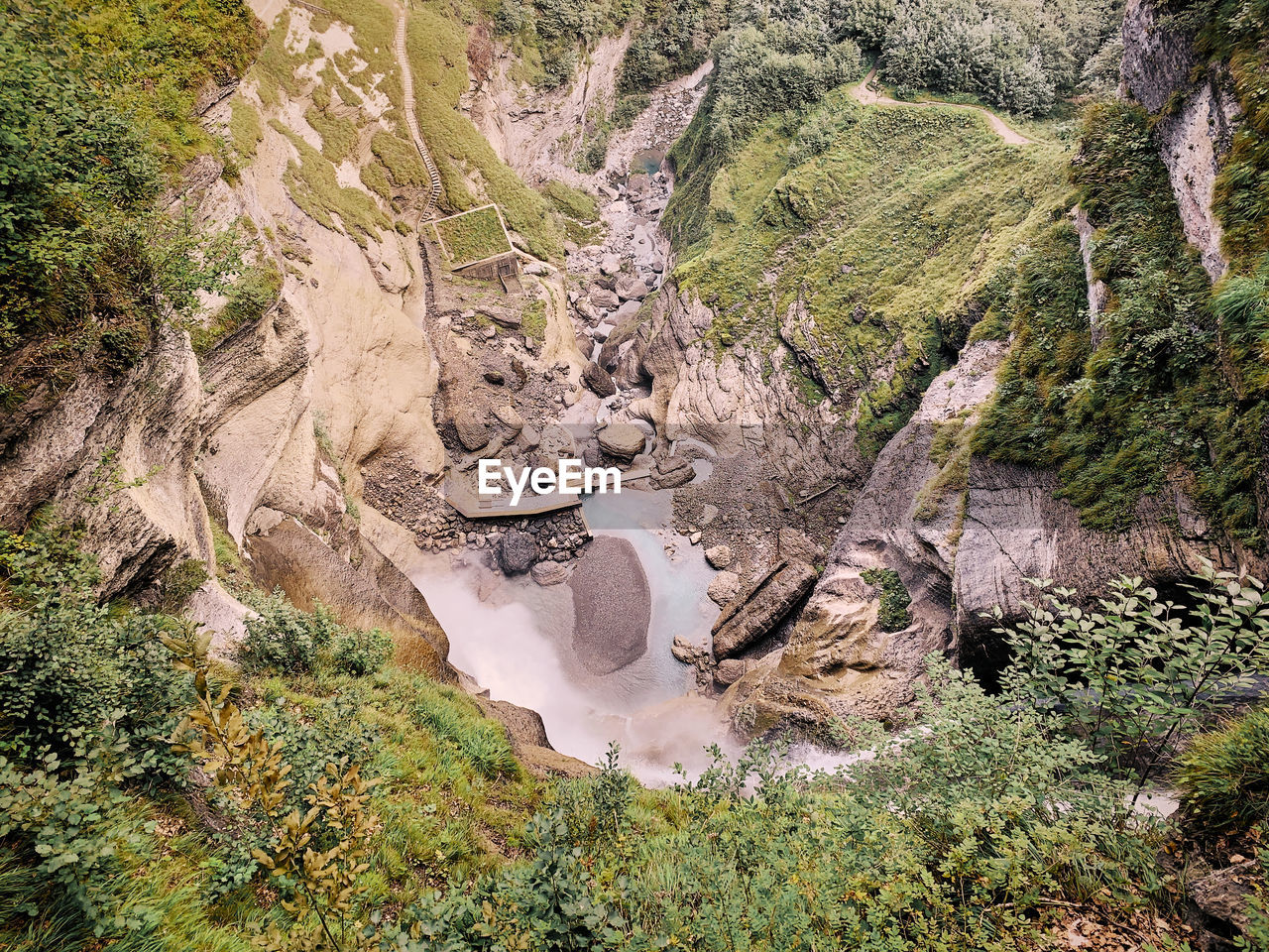 High angle view of water flowing through rocks