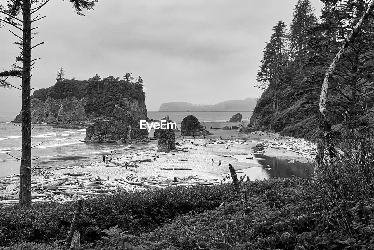 PANORAMIC VIEW OF BEACH AND ROCK FORMATION AGAINST SKY