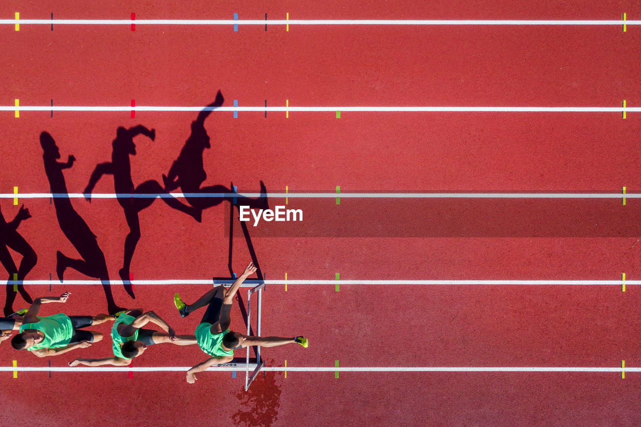 Aerial view of hurdler, serial image