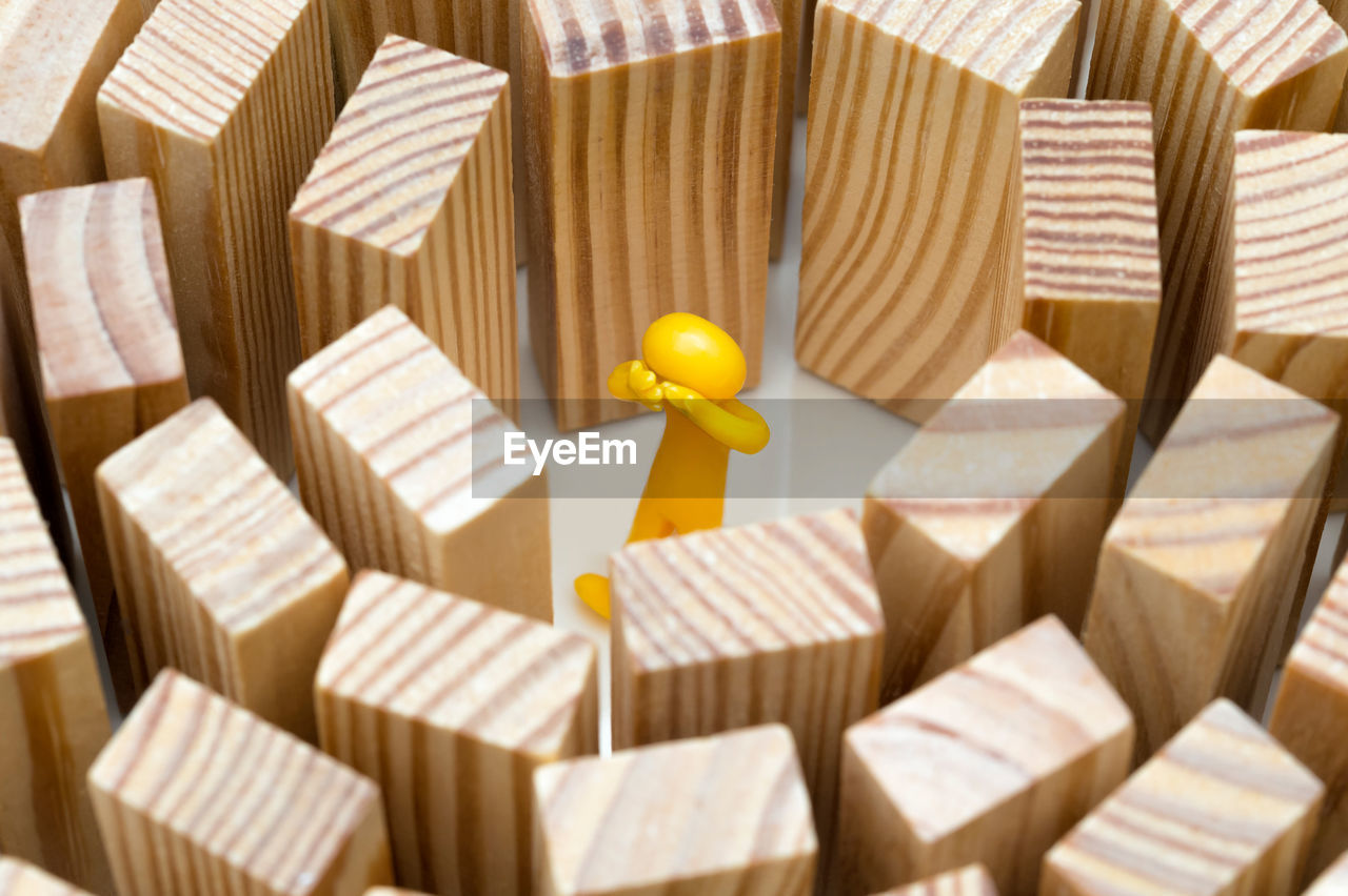 A human figure stands in the middle of high walls. concept photo how high blockades. figure cries.