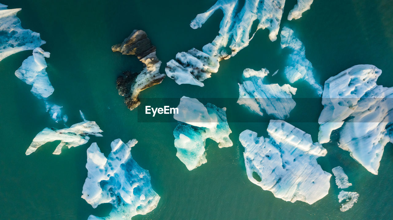 Aerial view of icebergs in sea during winter