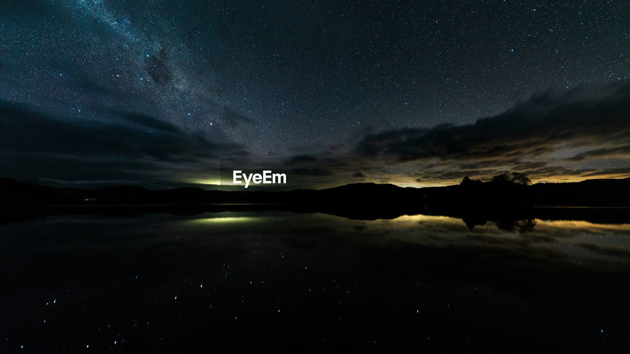 Lake under the milkyway in tasmania australia