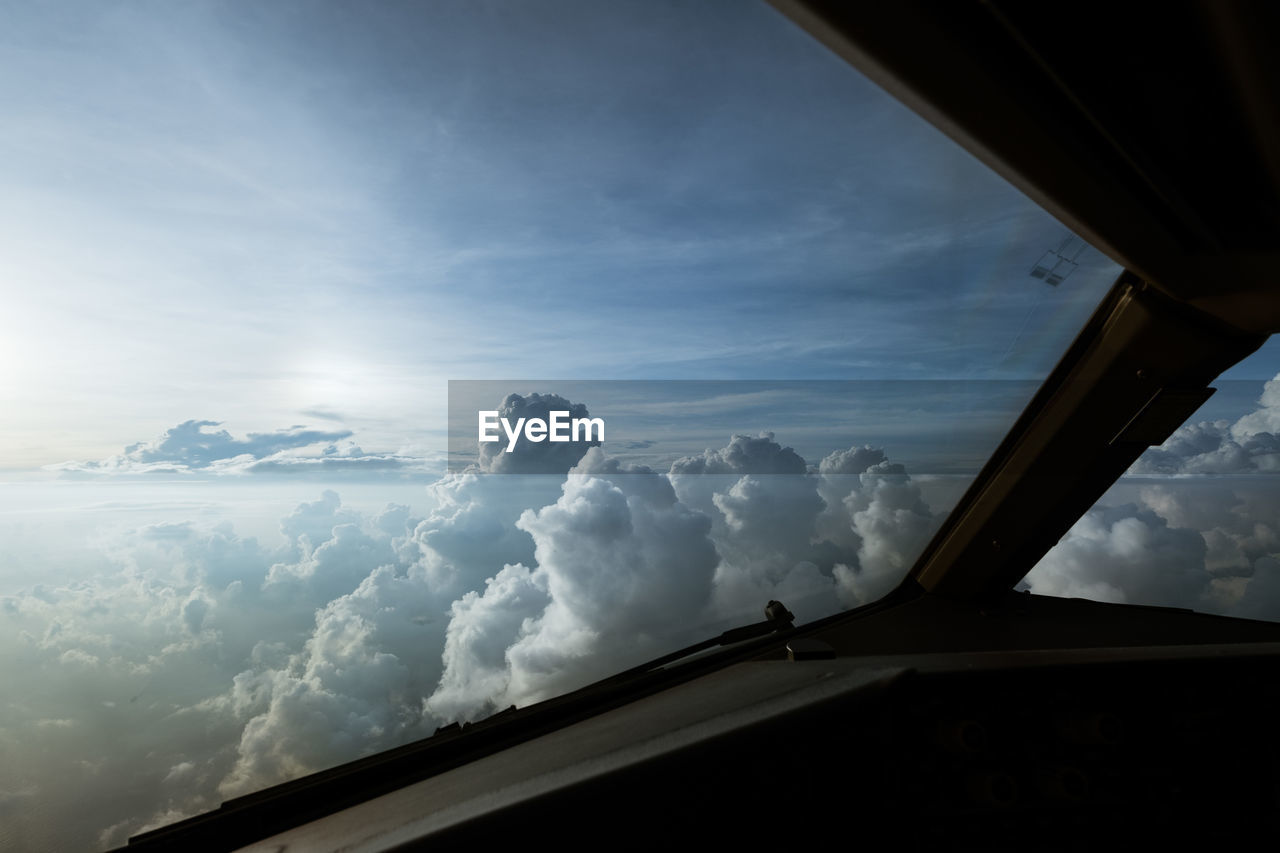 LOW ANGLE VIEW OF SILHOUETTE CAR WINDOW