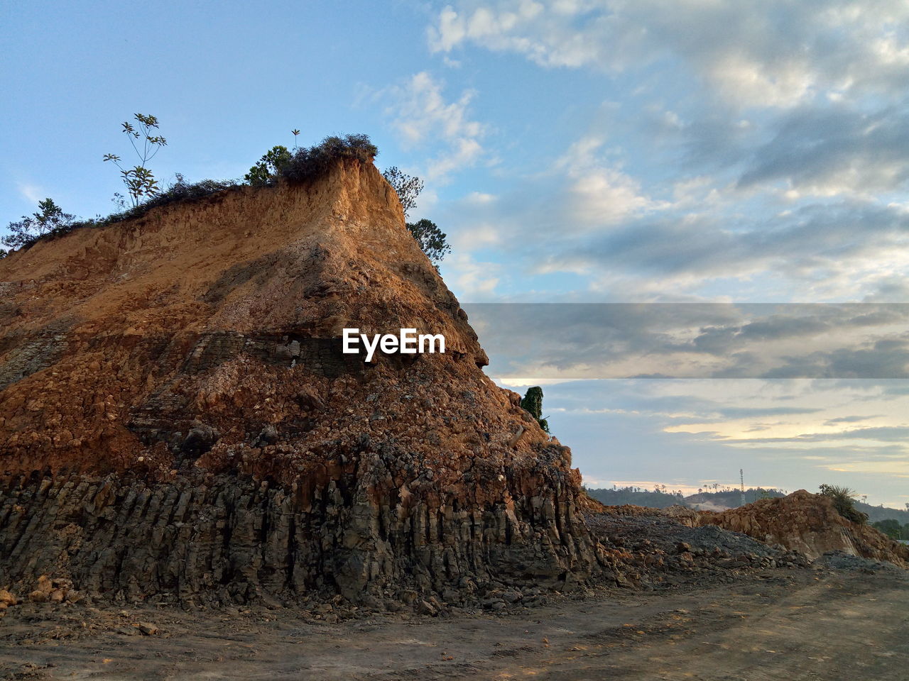 Rock formation on land against sky