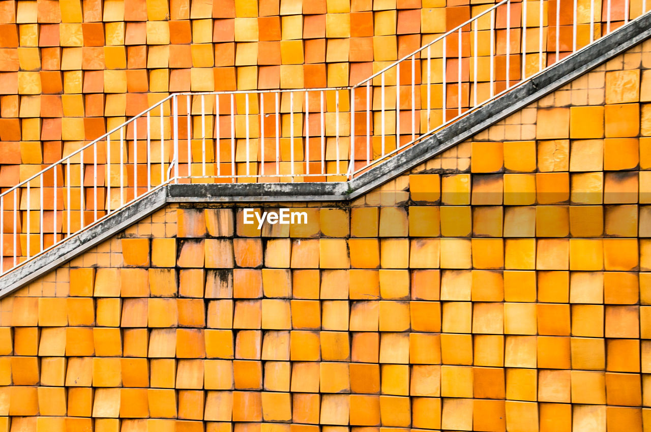 Full frame shot of yellow staircase against building