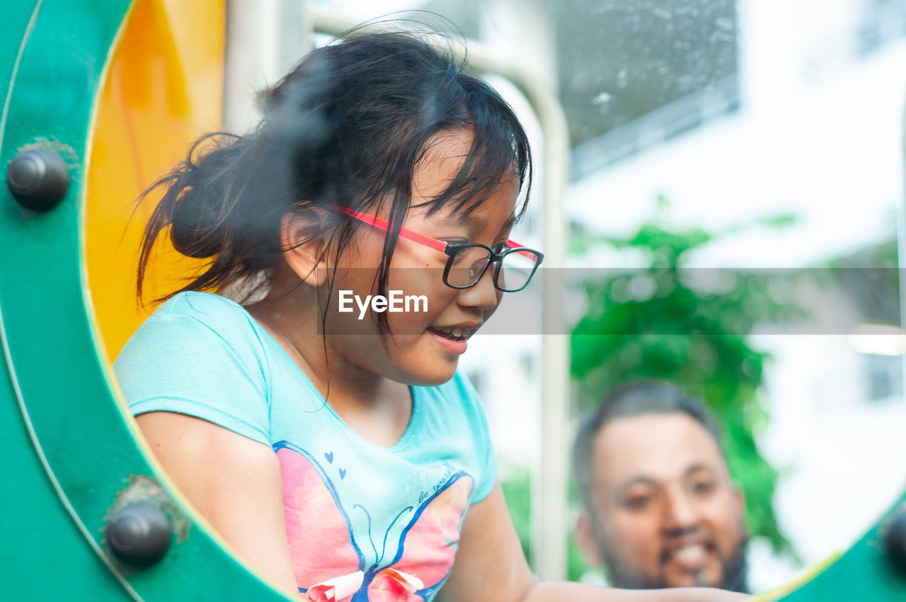 Close-up of girl playing on ground