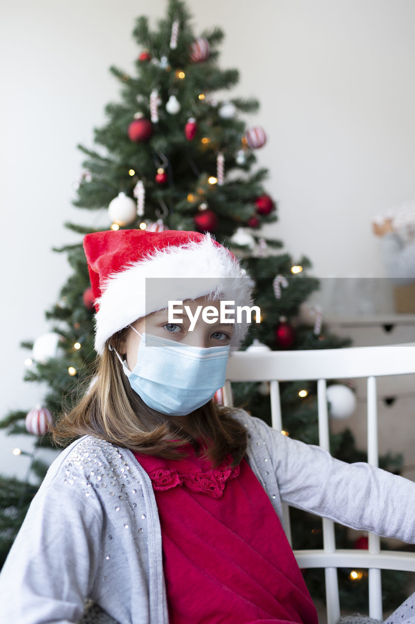 PORTRAIT OF GIRL WITH CHRISTMAS TREE