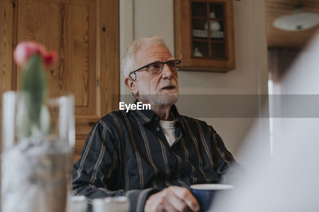 Senior man having coffee