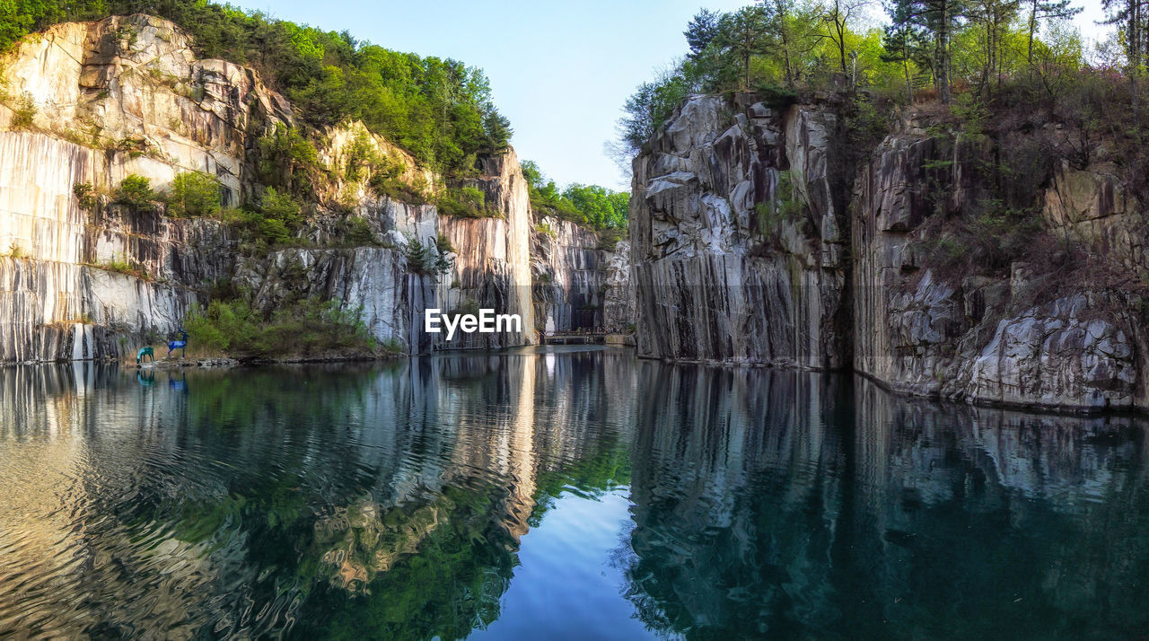  small lake in pocheon art valley. an old granite quarry turned into park with famous granite cliffs.