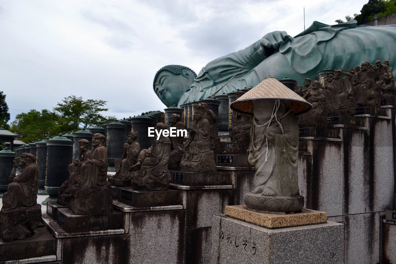 STATUE AGAINST SKY