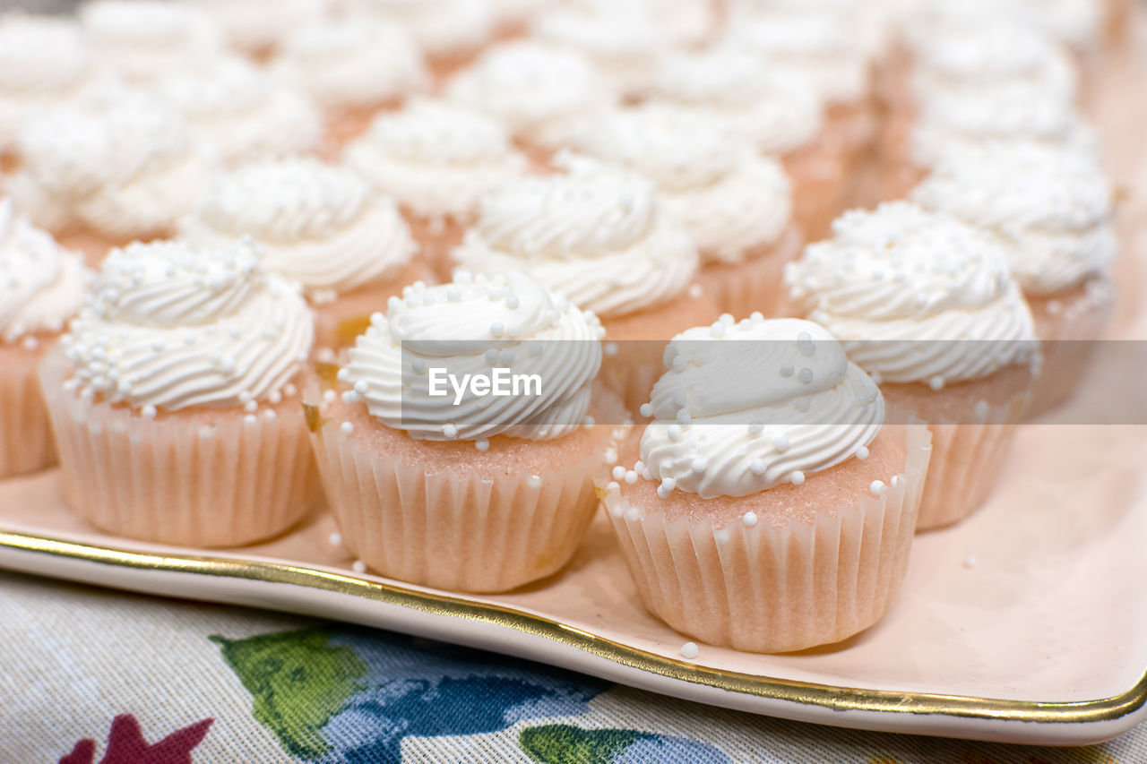 A platter of mini vanilla cupcakes