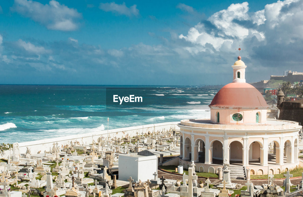 High angle view of cemetery by sea against sky