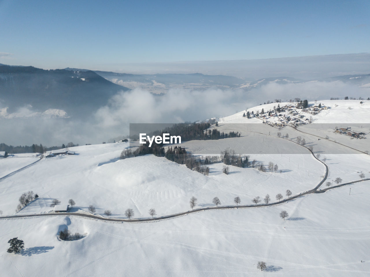 Scenic view of snow covered mountains against sky