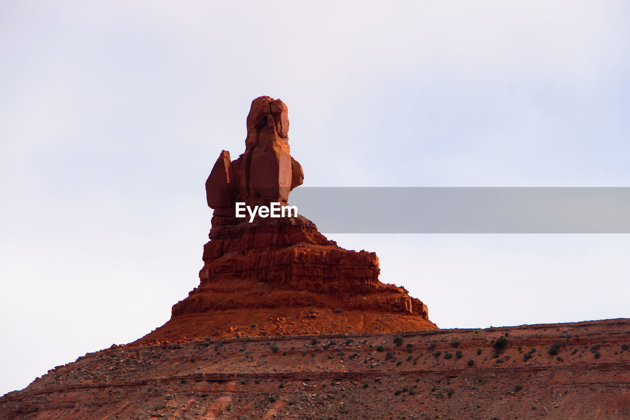 Low angle view of rock formations in mountain valley 