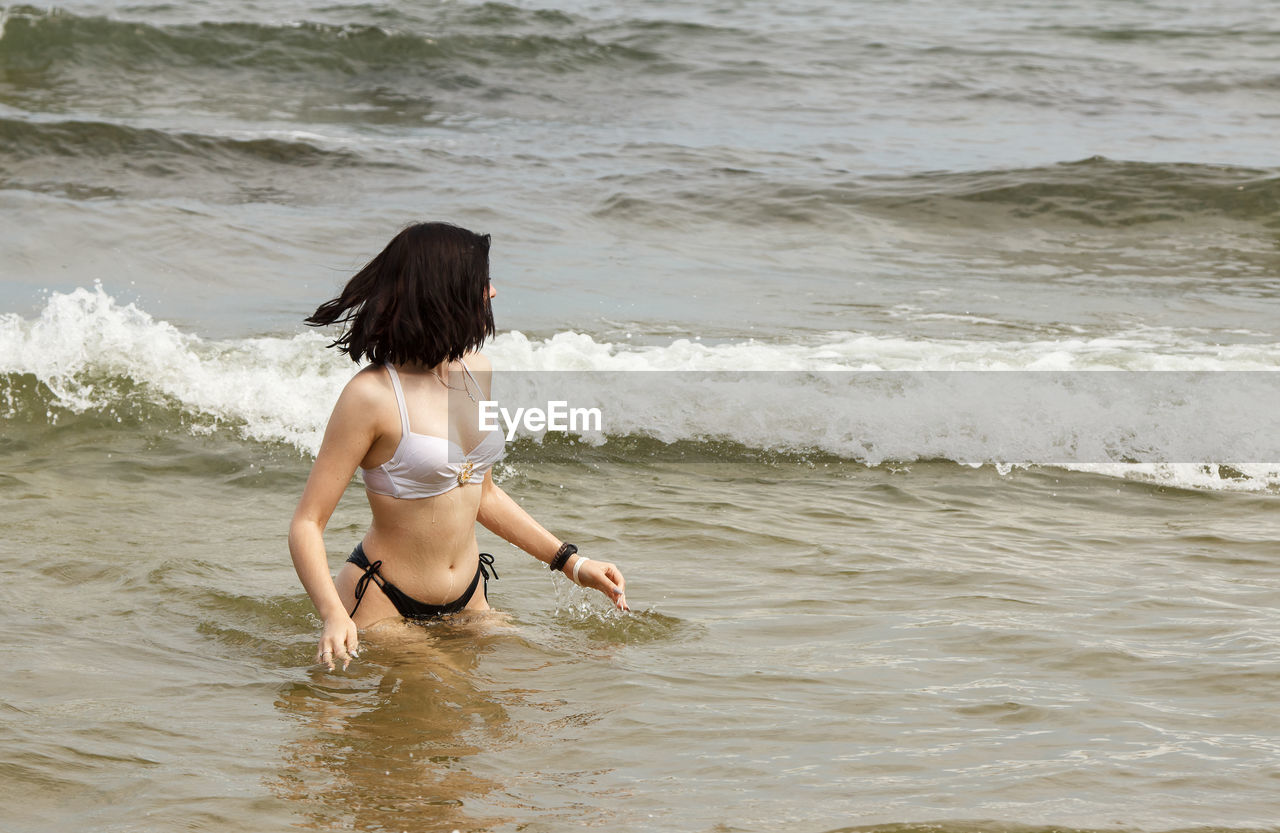 Woman swimming in sea