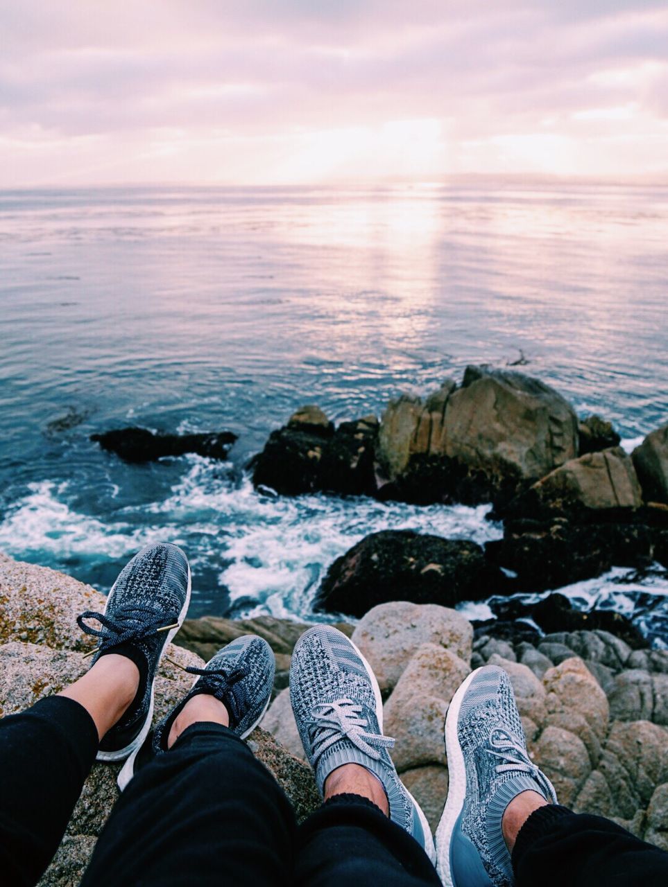 Low section of two people on beach