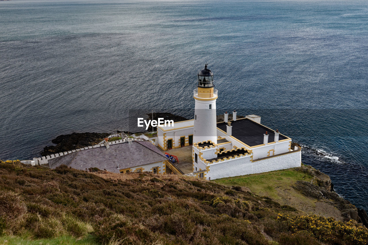 High angle view of lighthouse by sea