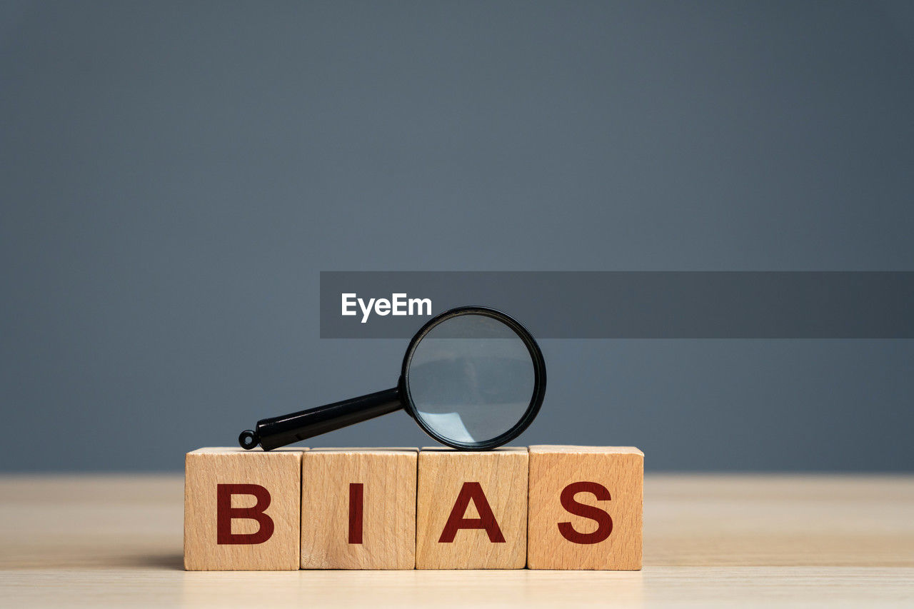 Bias word on a wooden blocks. prejudice. personal opinions. preconception.