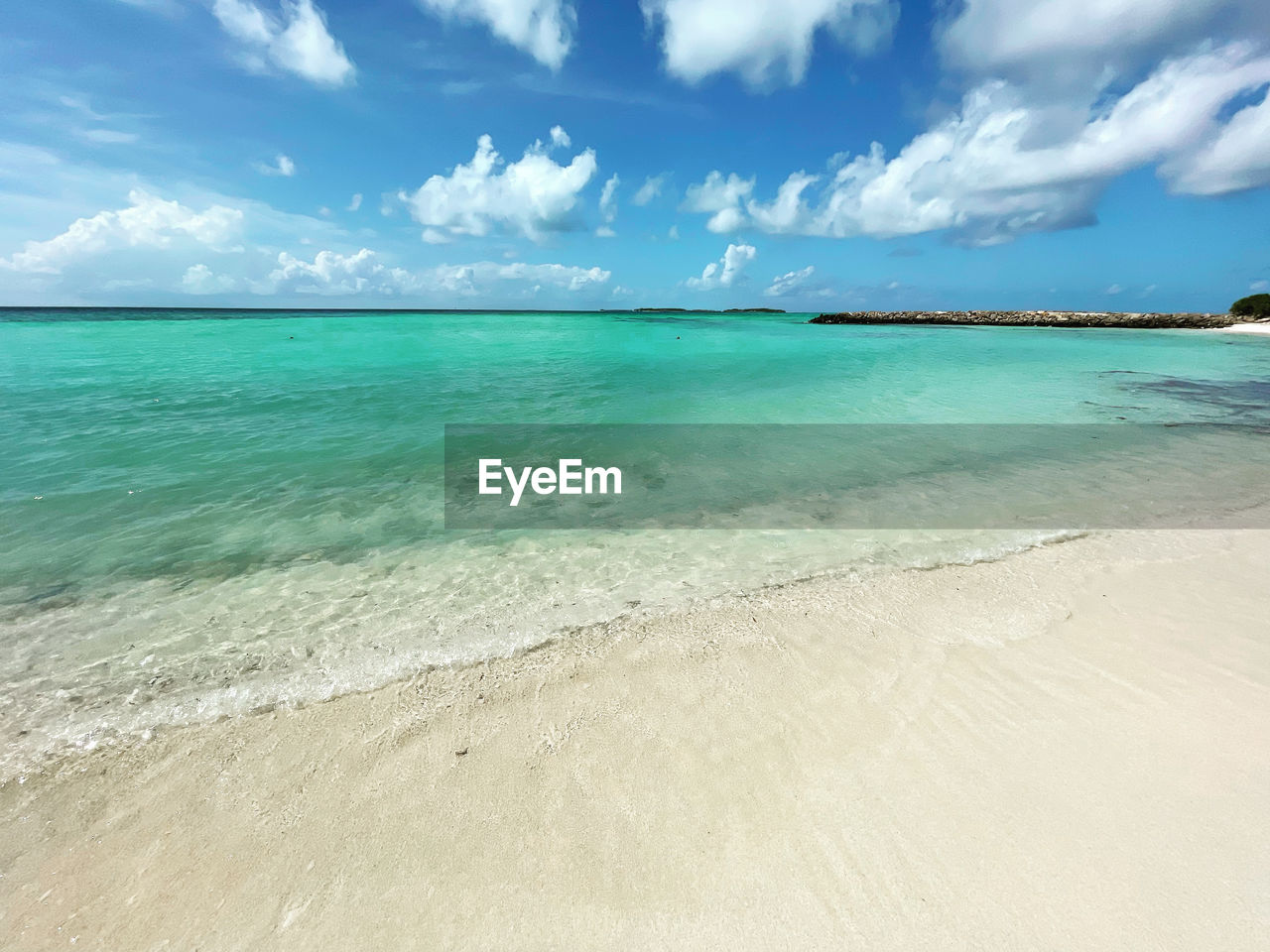 PANORAMIC VIEW OF BEACH AGAINST SKY