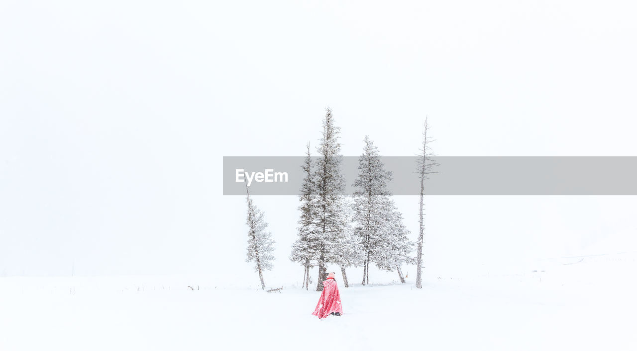 A red robe on snow