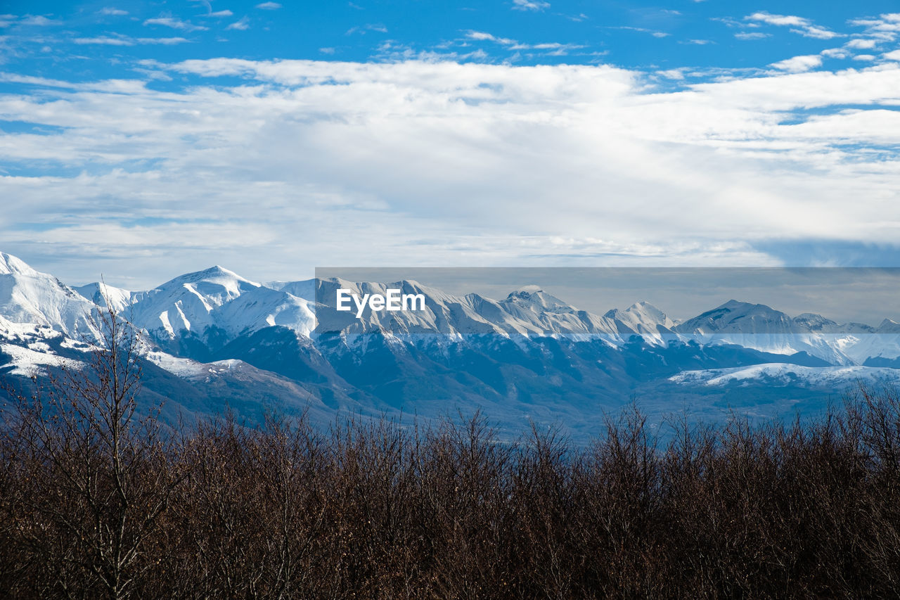 Scenic view of snowcapped mountains against sky in accumoli, lazio italy 