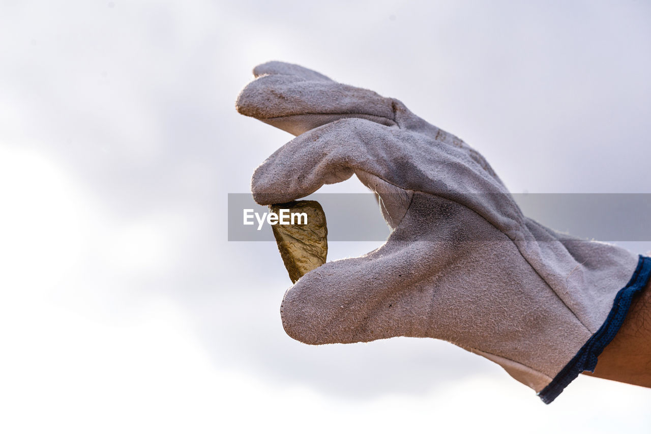 CLOSE-UP OF SCULPTURE AGAINST SKY