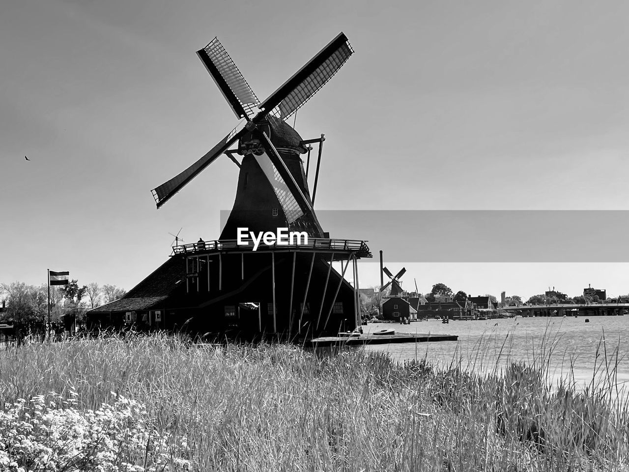 windmill, mill, renewable energy, alternative energy, wind power, wind turbine, turbine, black and white, traditional windmill, environmental conservation, power generation, environment, sky, nature, monochrome, monochrome photography, rural scene, landscape, field, plant, land, agriculture, architecture, grass, building, day, no people, built structure, farm, rural area, machine, wind, outdoors, water, history