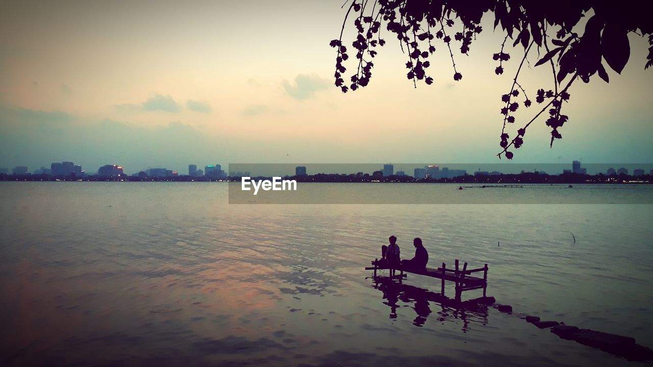 SCENIC VIEW OF LAKE DURING SUNSET