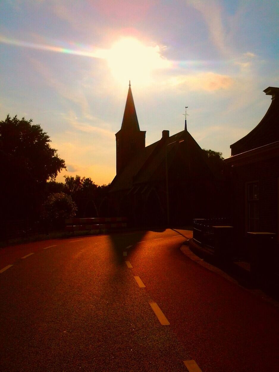 VIEW OF BUILDINGS AT SUNSET